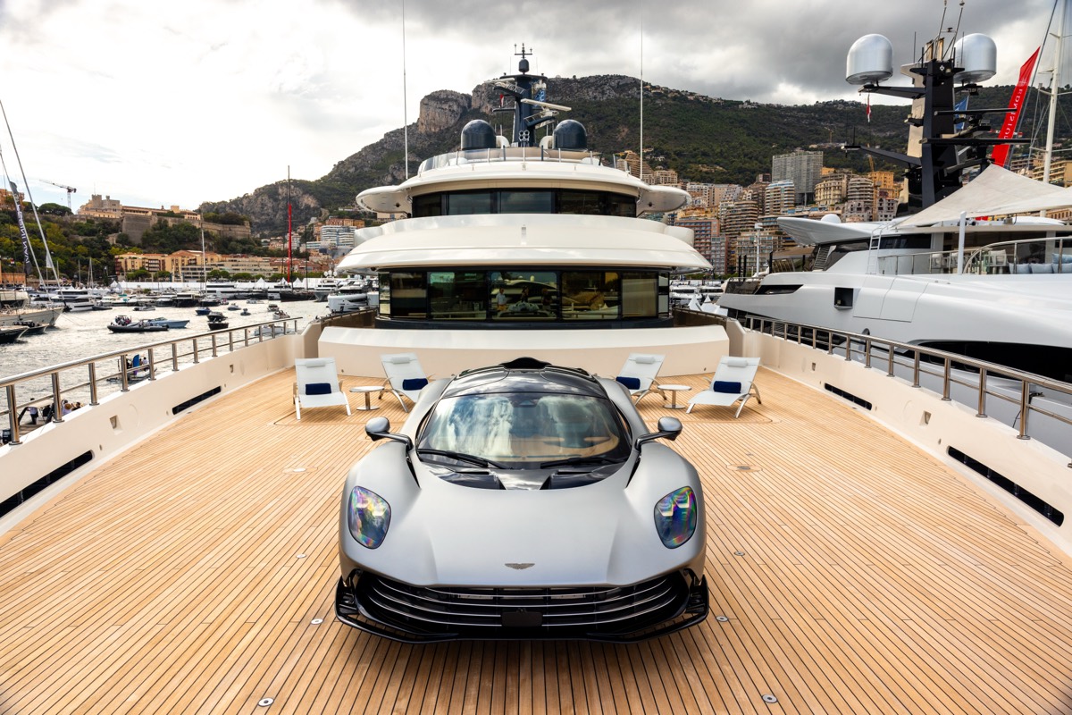 An Aston Martin Valhalla on the foredeck of a superyacht in Monaco harbour