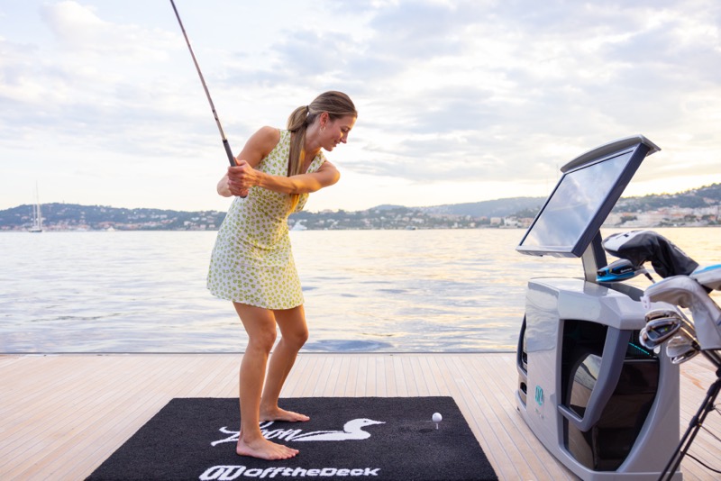 A guest mid swing on the Off The Deck mat
