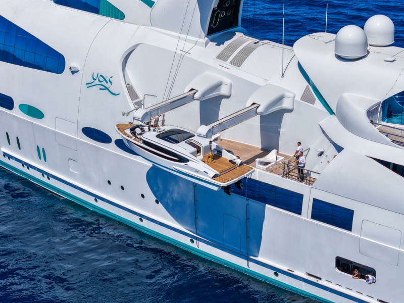 The tender in its launch position on the side deck of M/Y Yas