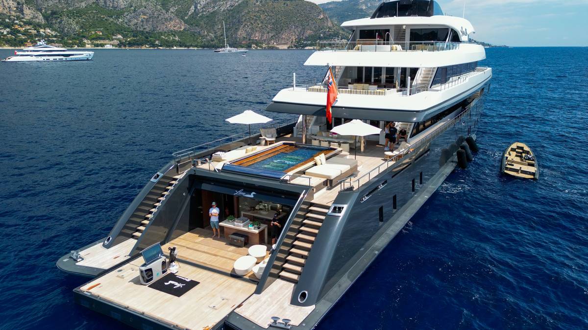 Aerial view of a superyacht with its beach club open, shot for the Off The Deck golfing simulator campaign