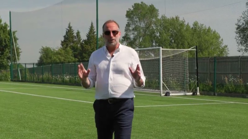 An agent talking to camera on a private all weather pitch