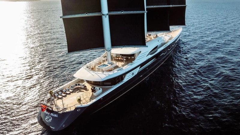 The sailing yacht Black Pearl under way with her black sails set, seen from above