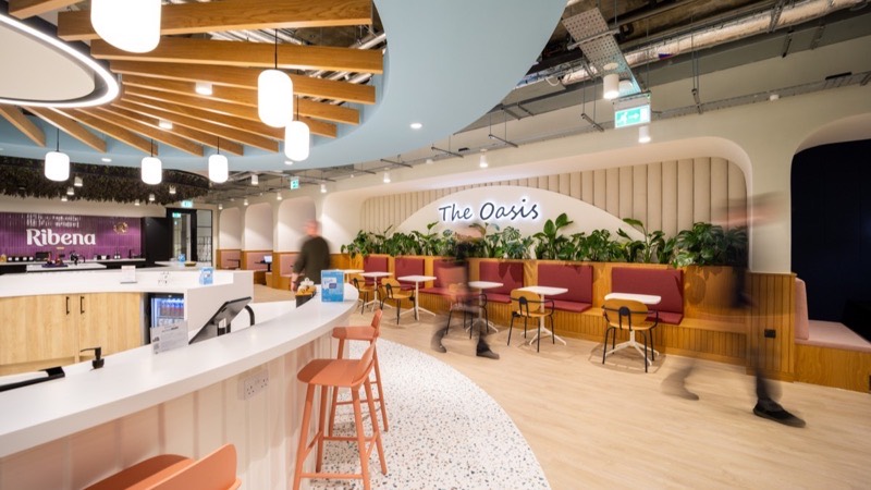 The Oasis, a planted social space at Suntory&rsquo;s offices with the Ribena bar beyond