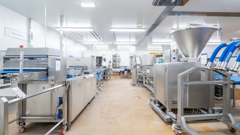 A food production line of stainless steel machinery in a clean room